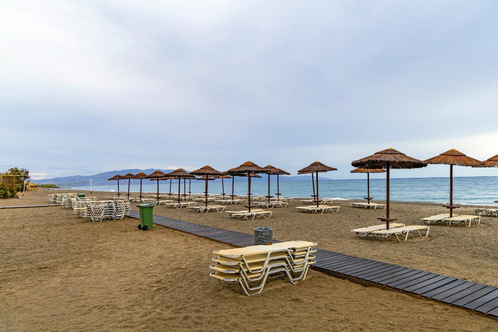 empty beach with sun loungers