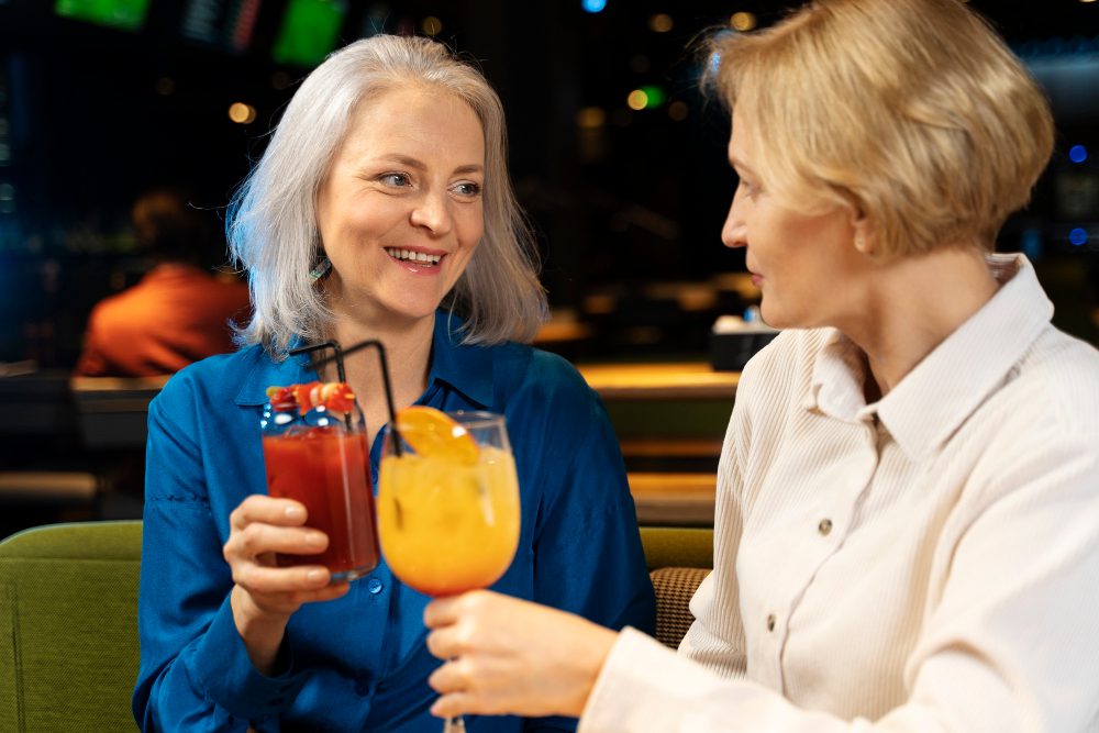 two older female friends drinking restaurant