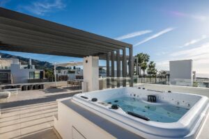 Rooftop terrace (solarium) with jacuzzi, bar, sea and mountain views in Marbella, Spain